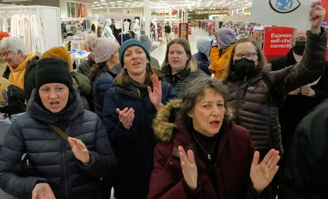 Community members and neighbors of people detained by ICE protest at a Target store, Monday, Jan. 19, 2026, in St. Paul, Minn. (AP Photo/Yuki Iwamura)
