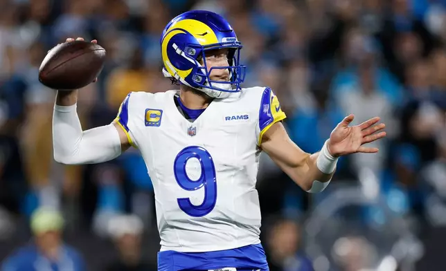 Los Angeles Rams quarterback Matthew Stafford (9) throws a pass during the second half of an NFL wild-card playoff football game against the Carolina Panthers, Saturday, Jan. 10, 2026, in Charlotte, N.C. (AP Photo/Rusty Jones)