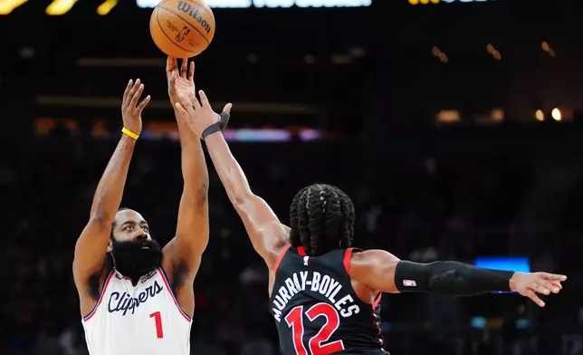 Los Angeles Clippers' James Harden (1) shoots over Toronto Raptors' Collin Murray-Boyles (12) during the first half of an NBA basketball game in Toronto, Friday, Jan. 16, 2026. (Frank Gunn/The Canadian Press via AP)