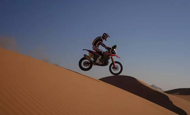 Rider Tosha Schareina competes during the eighth stage of the Dakar Rally with a start and finish at Wadi Ad Dawasir, Saudi Arabia, Monday, Jan.12, 2026. (AP Photo/Thibault Camus)