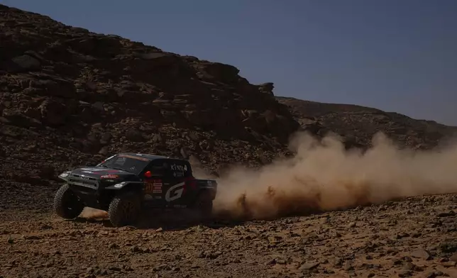 Driver Saood Variawa and co-driver Francois Cazalet compete during the eighth stage of the Dakar Rally with a start and finish at Wadi Ad Dawasir, Saudi Arabia, Monday, Jan.12, 2026. (AP Photo/Thibault Camus)