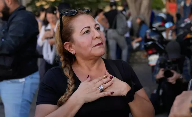 Atali Freites, the mother of Juan Jose Freites, arrives near El Helicoide, headquarters of Venezuela's intelligence service (SEBIN) and a detention center, in Caracas, Venezuela, Thursday, Jan. 8, 2026, after hearing National Assembly President Jorge Rodriguez say the government would release Venezuelan and foreign prisoners. (AP Photo/Ariana Cubillos)