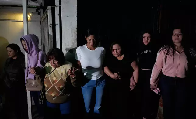 Relatives of political prisoners gather outside the Rodeo I prison in Guatire, Venezuela, Thursday, Jan. 8, 2026, after National Assembly President Jorge Rodriguez said the government would release Venezuelan and foreign prisoners. (AP Photo/Matias Delacroix)