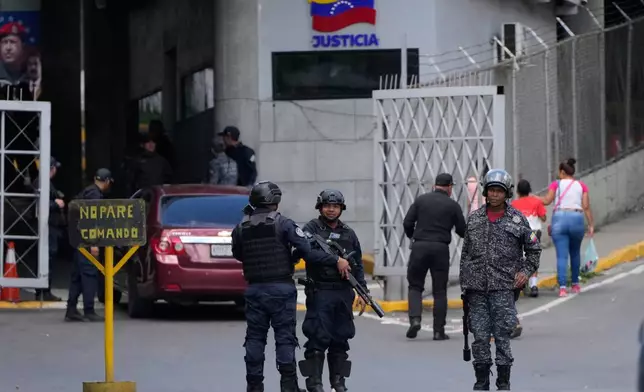 Police guard El Helicoide, the headquarters of Venezuela's intelligence service and detention center, in Caracas, Venezuela, Thursday, Jan. 8, 2026, after National Assembly President Jorge Rodriguez said the government would release Venezuelan and foreign prisoners. (AP Photo/Ariana Cubillos)