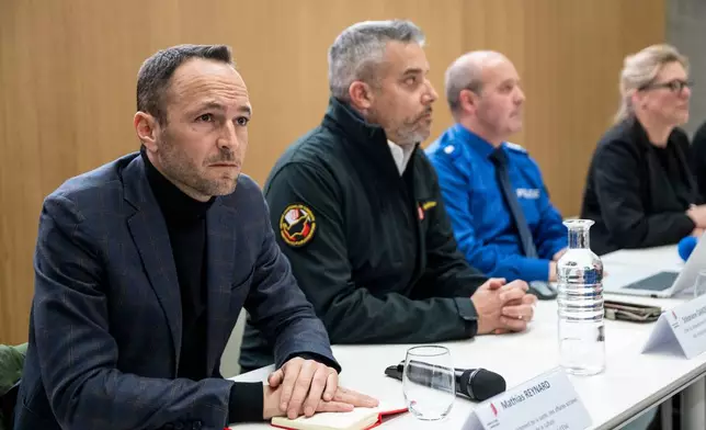 From left, Mathias Reynard, State Councillor and president of the Council of State of the Canton of Valais, Stephane Ganzer, State Councillor and head of the Department of Security, Institutions and Sport of the Canton of Valais, Frederic Gisler, Commander of the Valais Cantonal Police and Beatrice Pilloud, Attorney General of the Canton of Valais during a press conference in Lens, following a fire that broke out at the Le Constellation bar and lounge leaving people dead and injured, during New Year’s celebration, in Crans-Montana, Swiss Alps, Switzerland, Thursday, Jan. 1, 2026. (Alessandro della Valle/Keystone via AP)