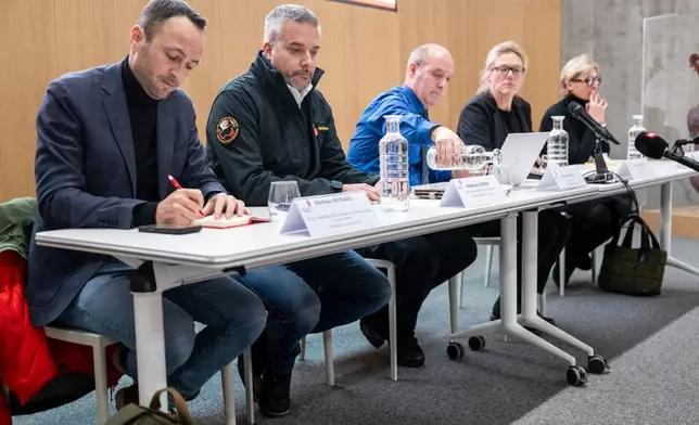 From left, Mathias Reynard, State Councillor and president of the Council of State of the Canton of Valais, Stephane Ganzer, State Councillor and head of the Department of Security, Institutions and Sport of the Canton of Valais, Frederic Gisler, Commander of the Valais Cantonal Police, Beatrice Pilloud, Attorney General of the Canton of Valais and Nicole Bonvin-Clivaz, Vice-President of the Municipal Council of Crans-Montana during a press conference in Lens, following a fire that broke out at the Le Constellation bar and lounge leaving people dead and injured, during New Year’s celebration, in Crans-Montana, Swiss Alps, Switzerland, Thursday, Jan. 1, 2026. (Alessandro della Valle/Keystone via AP)