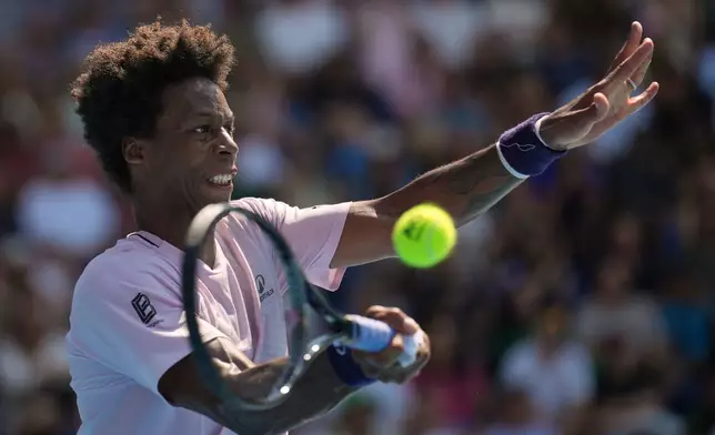 Gael Monfils of France plays a forehand return to Dane Sweeny of Australia during their first round match at the Australian Open tennis championship in Melbourne, Australia, Tuesday, Jan. 20, 2026. (AP Photo/Dita Alangkara)