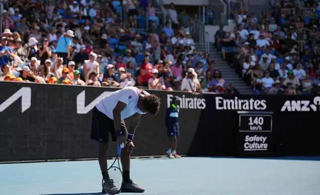 Gael Monfils of France reacts after a rally with Dane Sweeny of Australia during their first round match at the Australian Open tennis championship in Melbourne, Australia, Tuesday, Jan. 20, 2026. (AP Photo/Dita Alangkara)