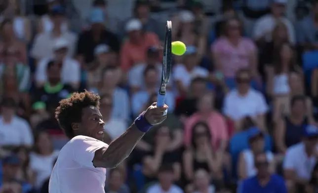 Gael Monfils of France plays a forehand return to Dane Sweeny of Australia during their first round match at the Australian Open tennis championship in Melbourne, Australia, Tuesday, Jan. 20, 2026. (AP Photo/Dita Alangkara)