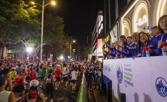The honored guests cheered on the runners of the Hong Kong Marathon. Photo source: FB of Mr. John Lee