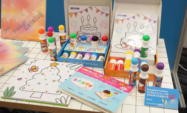 A Stationery Fair exhibitor presents dot markers, available in a wide range of colours and shapes, designed for artistic enlightenment and improving the learning cognition of children aged three and over. Photo source: reference image