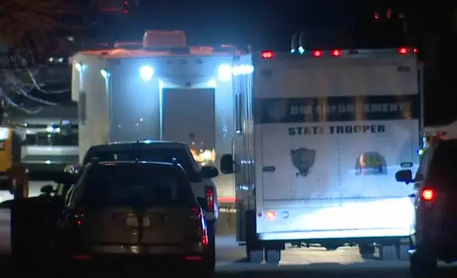 In this grab taken from video, emergency cervices work at a scene of Police Helicopter Crash in Flagstaff, Arizona, the night from Feb. 4 to 5, 2026. (ABC15 Arizona via AP)