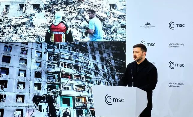 Ukraine's President Volodymyr Zelenskyy addresses the audience during a session at the Munich Security Conference in Munich, Germany, Saturday, Feb. 14, 2026. (AP Photo/Michael Probst)