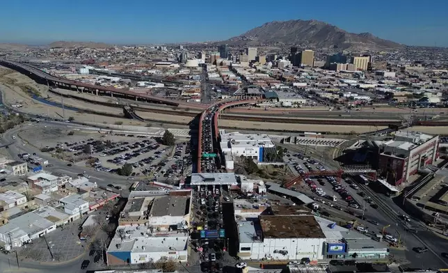 Cars cross the "Paso del Norte" International Bridge at the U.S.-Mexico border between Ciudad Juarez, Mexico, bottom, and El Paso, Texas, top, Wednesday Feb. 11, 2026. (AP Photo/Christian Chavez)
