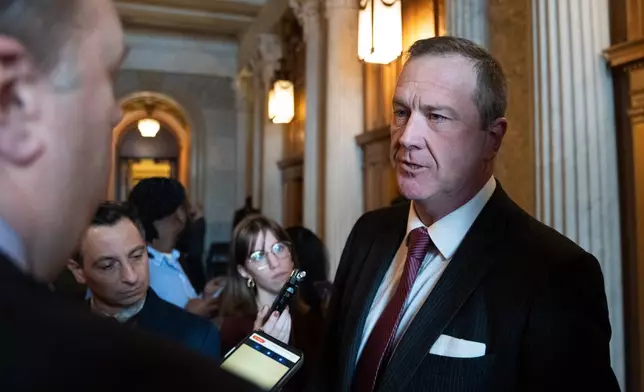 Sen. Eric Schmitt, R-Mo., speaks to members of the media at the Capitol, Thursday, Feb. 12, 2026, in Washington. (AP Photo/Allison Robbert)