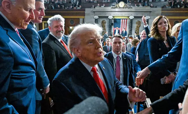 President Donald Trump exits the House Chamber after delivering the State of the Union address to a joint session of Congress in the House chamber at the U.S. Capitol in Washington, Tuesday, Feb. 24, 2026. (Kenny Holston/The New York Times via AP, Pool)