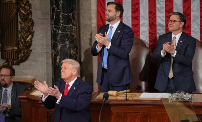 President Donald Trump applauds with Vice President JD Vance and House Speaker Mike Johnson of La., as he delivers the State of the Union address to a joint session of Congress in the House chamber at the U.S. Capitol in Washington, Tuesday, Feb. 24, 2026. (AP Photo/Matt Rourke)