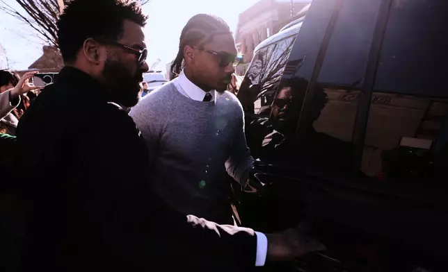 New England Patriots wide receiver Stefon Diggs leaves Norfolk County District Court after his arraignment on felony strangulation and a misdemeanor assault charges, Friday, Feb. 13, 2026, in Dedham, Mass. (AP Photo/Charles Krupa)