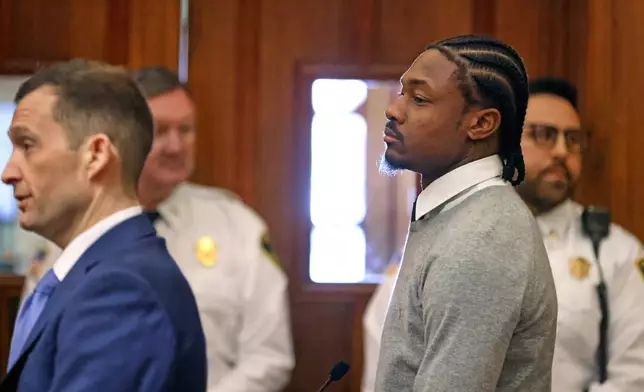 New England Patriots' Stefon Diggs, right, appears for his arraignment on felony strangulation and a misdemeanor assault charges, Friday, Feb. 13, 2026, at District Court in Dedham, Mass. (David L. Ryan/The Boston Globe via AP, Pool)