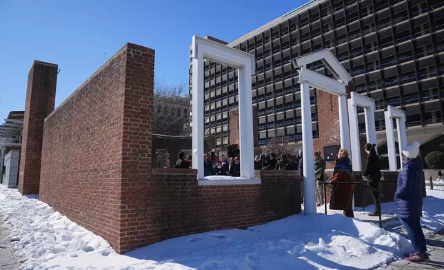 U.S. District Judge Cynthia Rufe, at threshold, inspects the location of the now removed explanatory panels that were part of an exhibit on slavery at President's House Site in Philadelphia, Monday, Feb. 2, 2026. (AP Photo/Matt Rourke)