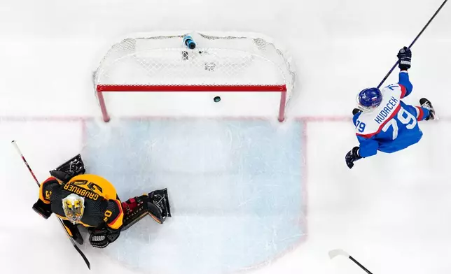 Slovakia's Libor Hudacek (79) celebrates after Slovakia's Dalibor Dvorsky, not seen, scored his side's fourth goal during a men's ice hockey quarterfinal game between Slovakia and Germany at the 2026 Winter Olympics, in Milan, Italy, Wednesday, Feb. 18, 2026. (AP Photo/Petr David Josek)