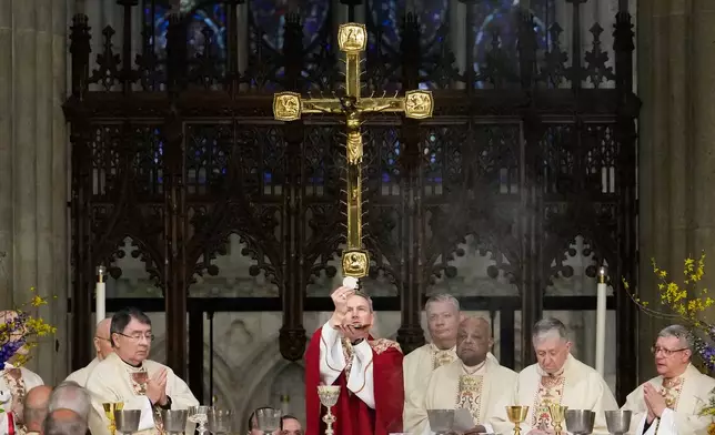 Archbishop Ronald Hicks says the Eucharistic prayer during his Mass of Installation at St. Patrick's Cathedral, Friday, Feb. 6, 2026, in New York. (AP Photo/Yuki Iwamura)