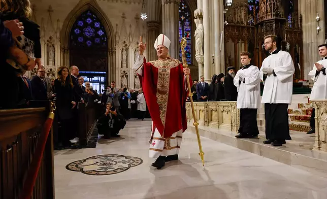 Archbishop Ronald Hicks gives a blessing after his Mass of Installation at St. Patrick's Cathedral, Friday, Feb. 6, 2026, in New York. (AP Photo/Stefan Jeremiah, Pool)