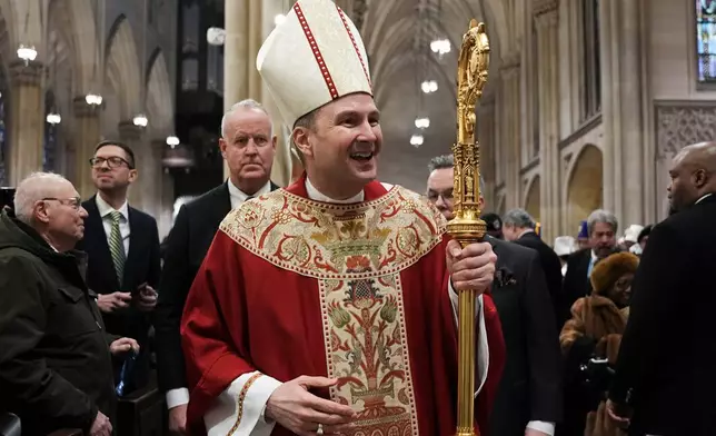 New York Archbishop-designate Ronald A. Hicks, who is taking over from Cardinal Timothy Dolan, leaves after his Installation Mass at St. Patrick's Cathedral in the Manhattan borough of New York on Friday, Feb. 6, 2026. (Angelina Katsanis/ Pool Reuters via AP)