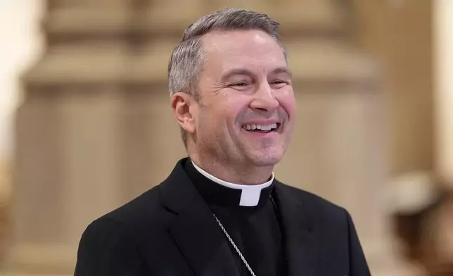 Archbishop-designate Ronald Hicks laughs during a news conference at St. Patrick's Cathedral in New York, Thursday, Feb. 5, 2026. (AP Photo/Seth Wenig)