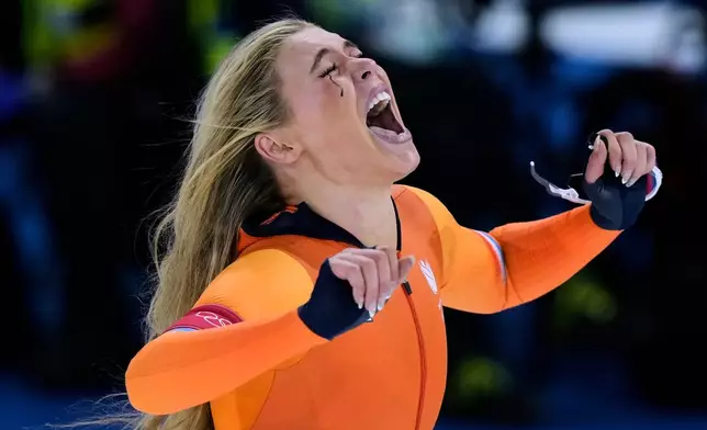 Jutta Leerdam of the Netherlands celebrates winning the gold medal in the women's 1,000 meters speedskating race at the 2026 Winter Olympics, in Milan, Italy, Monday, Feb. 9, 2026. (AP Photo/Luca Bruno)
