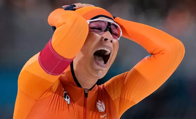 Jutta Leerdam of the Netherlands celebrates winning the gold medal in the women's 1,000 meters speedskating race at the 2026 Winter Olympics, in Milan, Italy, Monday, Feb. 9, 2026. (AP Photo/Ben Curtis)