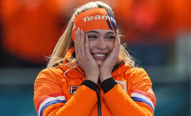 Gold medallist Jutta Leerdam of the Netherlands reacts on the podium of the women's 1,000 meters speedskating race at the 2026 Winter Olympics, in Milan, Italy, Monday, Feb. 9, 2026. (AP Photo/Antonio Calanni)