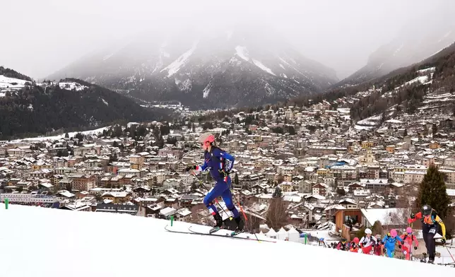 France's Emily Harrop competes during a ski mountaineering mixed relay, at the 2026 Winter Olympics, in Bormio, Italy, Saturday, Feb. 21, 2026. (AP Photo/Rebecca Blackwell)