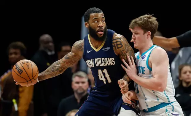 New Orleans Pelicans guard Saddiq Bey (41) looks to pass the ball against Charlotte Hornets guard Kon Knueppel, right, during the first half of an NBA basketball game in Charlotte, N.C., Monday, Feb. 2, 2026. (AP Photo/Nell Redmond)