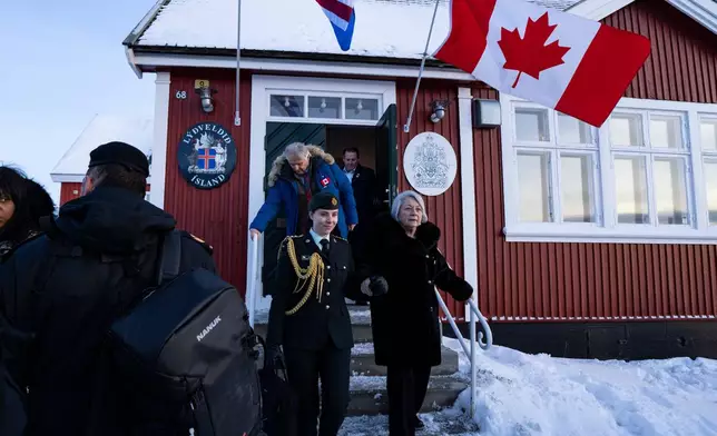 Canadian Governor General Mary Simon, right, leaves the newly opened Canadian consulate in Nuuk, Greenland, on Friday, Feb. 6, 2026. (Christinne Muschi/The Canadian Press via AP)