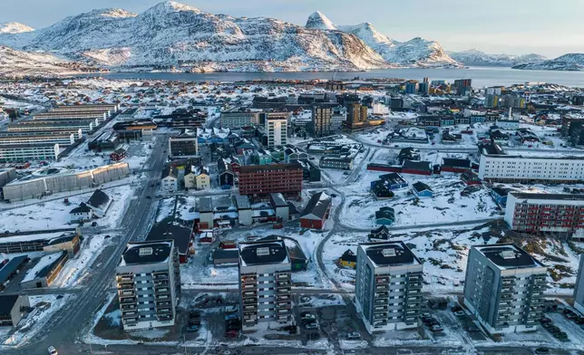 Houses are seen in Nuuk, Greenland, on Sunday, Jan. 25, 2026. (AP Photo/Evgeniy Maloletka)