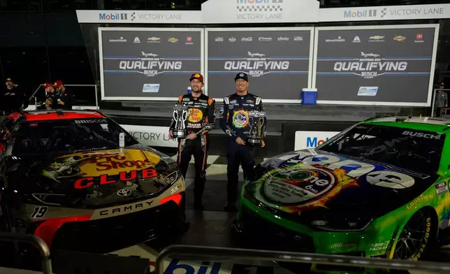 Chase Briscoe and Kyle Busch, from left, pose for a photo after NASCAR Daytona 500 qualifying, Wednesday, Feb. 11, 2026, in Daytona, Fla. (AP Photo/Mike Stewart)