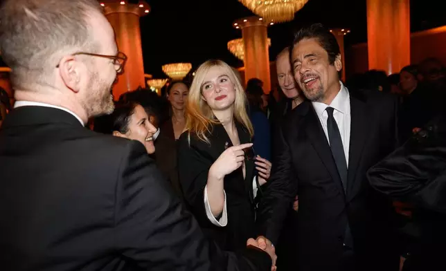 Joachim Trier, from left, Brittany Kahan, Elle Fanning, and Benicio Del Toro attend the 98th Academy Awards Oscar nominees luncheon on Tuesday, Feb. 10, 2026, at the Beverly Hilton Hotel in Beverly Hills, Calif. (Photo by Caroline Brehman/Invision/AP)