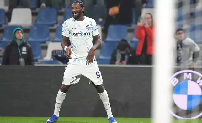 Inter Milan's Marcus Thuram celebrates after scoring their side's second goal of the game during the Serie A soccer match between Sassuolo and Inter in Milan, Italy, Sunday, Feb. 8, 2026. (Spada/LaPresse via AP)