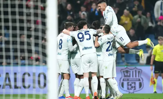 Inter Milan's Manuel Akanji celebrates after scoring their side's fourth goal of the game during the Serie A soccer match between Sassuolo and Inter in Milan, Italy, Sunday, Feb. 8, 2026. (Spada/LaPresse via AP)