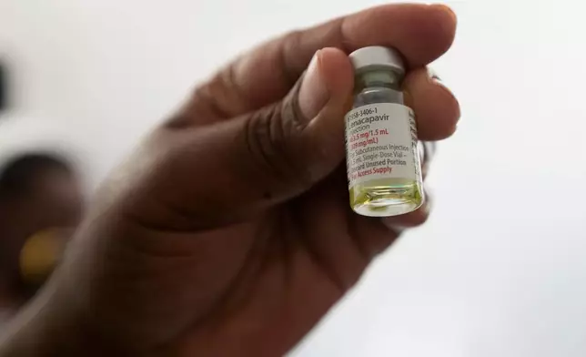A nurse holds a vial of lenacapavir, a new HIV prevention drug, in Harare, Zimbabwe, Thursday, Feb. 19, 2026. (AP Photo/Aaron Ufumeli)