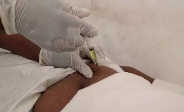 A nurse administers lenacapavir to Tambudzai Ndlovu during the launch of the new HIV prevention drug in Harare, Zimbabwe, Thursday, Feb. 19, 2026. (AP Photo/Aaron Ufumeli)