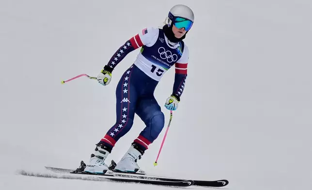 United States' Lindsey Vonn arrives at the finish area of an alpine ski women's downhill training, at the 2026 Winter Olympics, in Cortina d'Ampezzo, Italy, Saturday, Feb. 7, 2026. (AP Photo/Andy Wong)