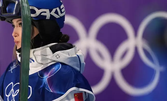 China's Eileen Gu waits for her scores as she competes in the women's freestyle skiing big air qualifications at the 2026 Winter Olympics, in Livigno, Italy, Saturday, Feb. 14, 2026. (AP Photo/Abbie Parr)