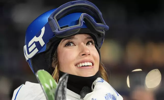 China's Eileen Gu waits for her score as she competes in the women's freestyle skiing big air qualifications at the 2026 Winter Olympics, in Livigno, Italy, Saturday, Feb. 14, 2026. (AP Photo/Abbie Parr)