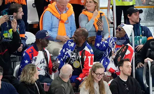 Snoop Dog watches the women's 500 meters speedskating race at the 2026 Winter Olympics, in Milan, Italy, Sunday, Feb. 15, 2026. (AP Photo/Ben Curtis)
