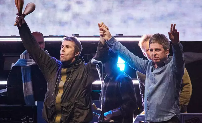 FILE - Liam Gallagher, left, and Noel Gallagher of Oasis appear during their reunion tour in Toronto on Aug. 24, 2025. (Sammy Kogan/The Canadian Press via AP, File)