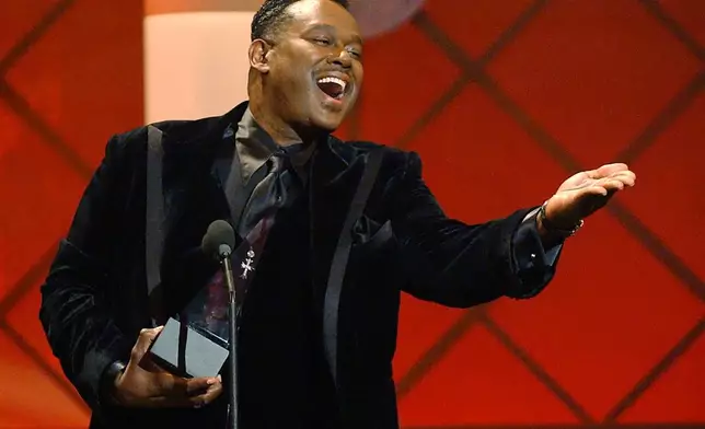 FILE - Luther Vandross accepts the award for favorite soul or R&amp;B male artist at the 29th American Music Awards in Los Angeles on Jan. 9, 2002. (AP Photo/Kevork Djansezian, File)