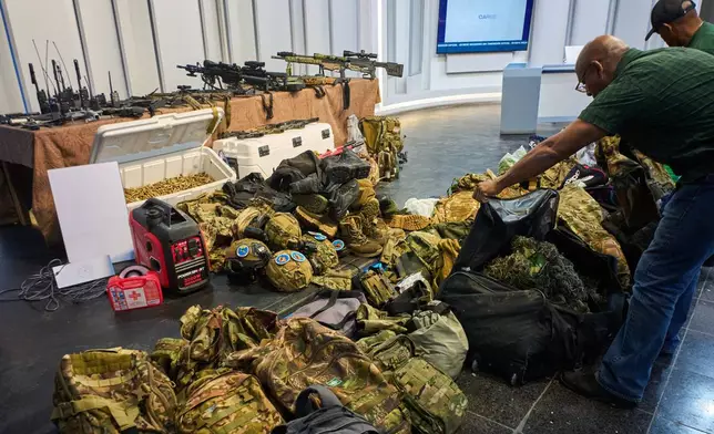 Weapons that Cuban authorities say were recovered from a speedboat in Cuban waters following a confrontation that left four people dead are displayed during a media presentation in Havana, Friday, Feb. 27, 2026. (AP Photo/Ramon Espinosa)