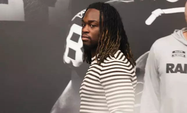 Las Vegas Raiders running back Ashton Jeanty looks on during a news conference introducing new head coach Klint Kubiak, Tuesday, Feb. 10, 2026, at the NFL football team's training facility in Henderson, Nev. (AP Photo/Ian Maule)